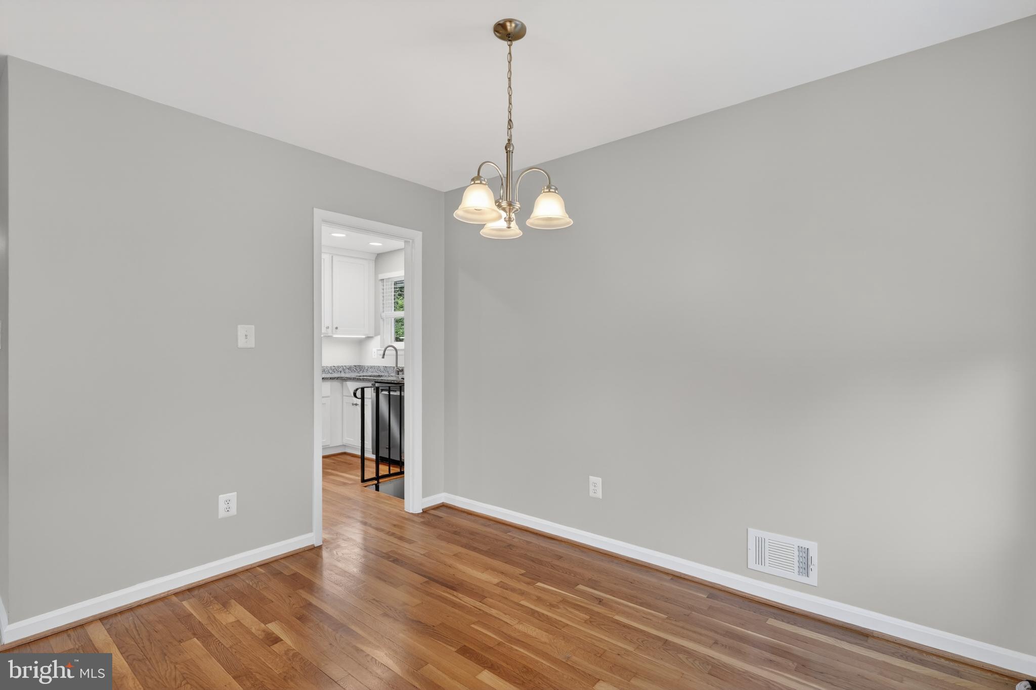 4625 Strathblane Place Alexandria, VA 22304 - Photo 5 of 22 a view of a room with wooden floor and white walls