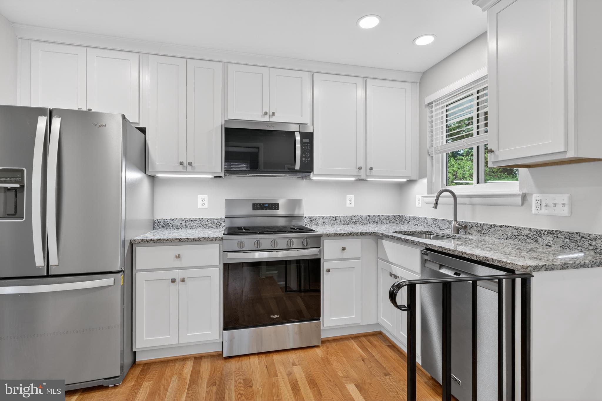 4625 Strathblane Place Alexandria, VA 22304 - Photo 6 of 22 a kitchen with granite countertop a sink stove and refrigerator