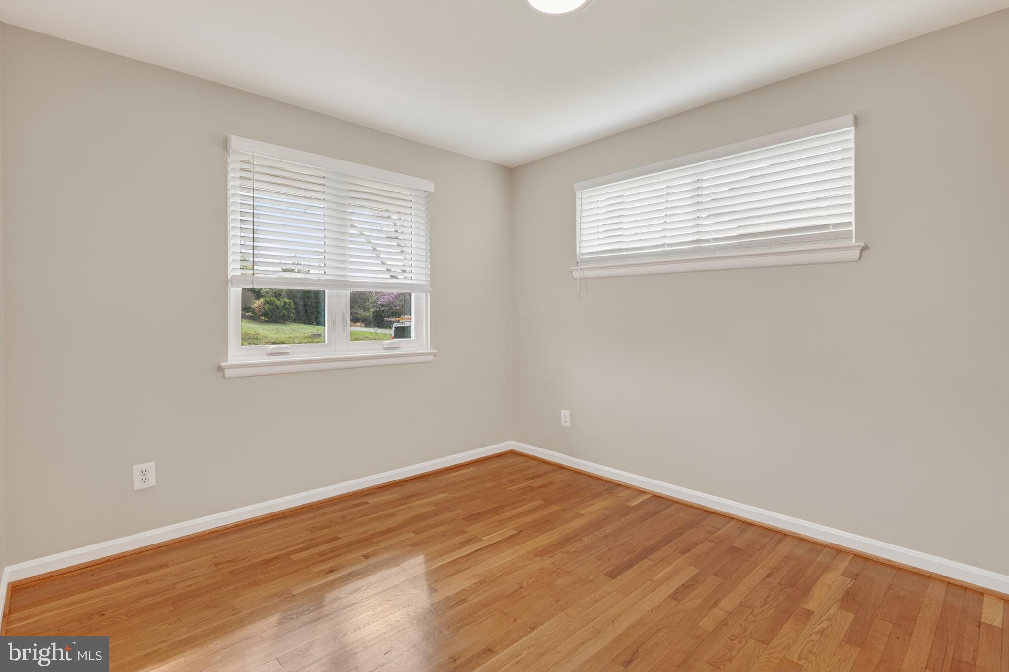 4625 Strathblane Place Alexandria, VA 22304 - Photo 10 of 22 a view of an empty room with wooden floor and a window