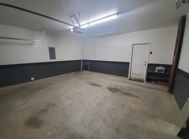 a view of empty room with a fireplace