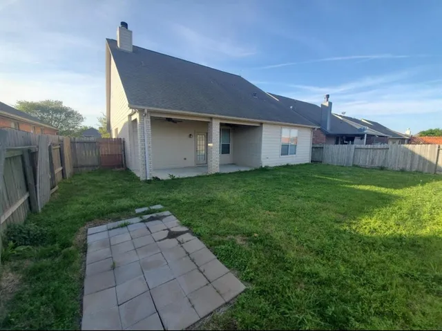 a backyard of a house with lots of green space