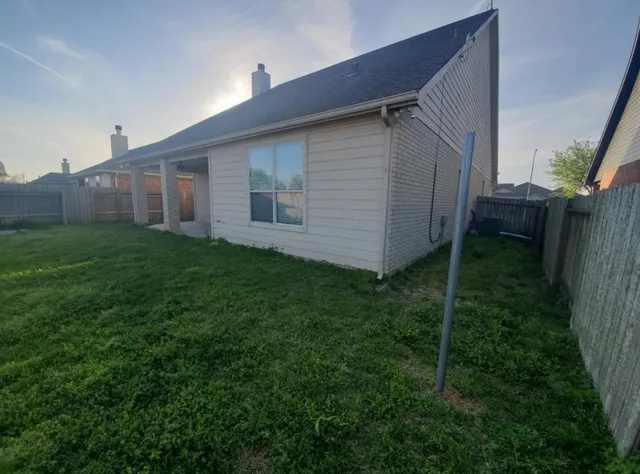 a view of a back yard of the house