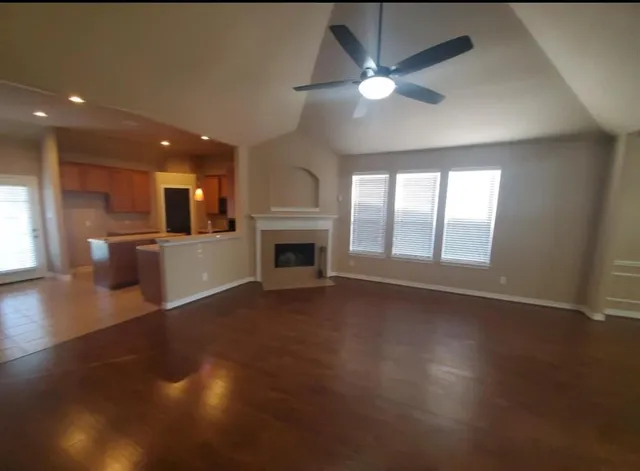 an open kitchen with a sink and a fireplace