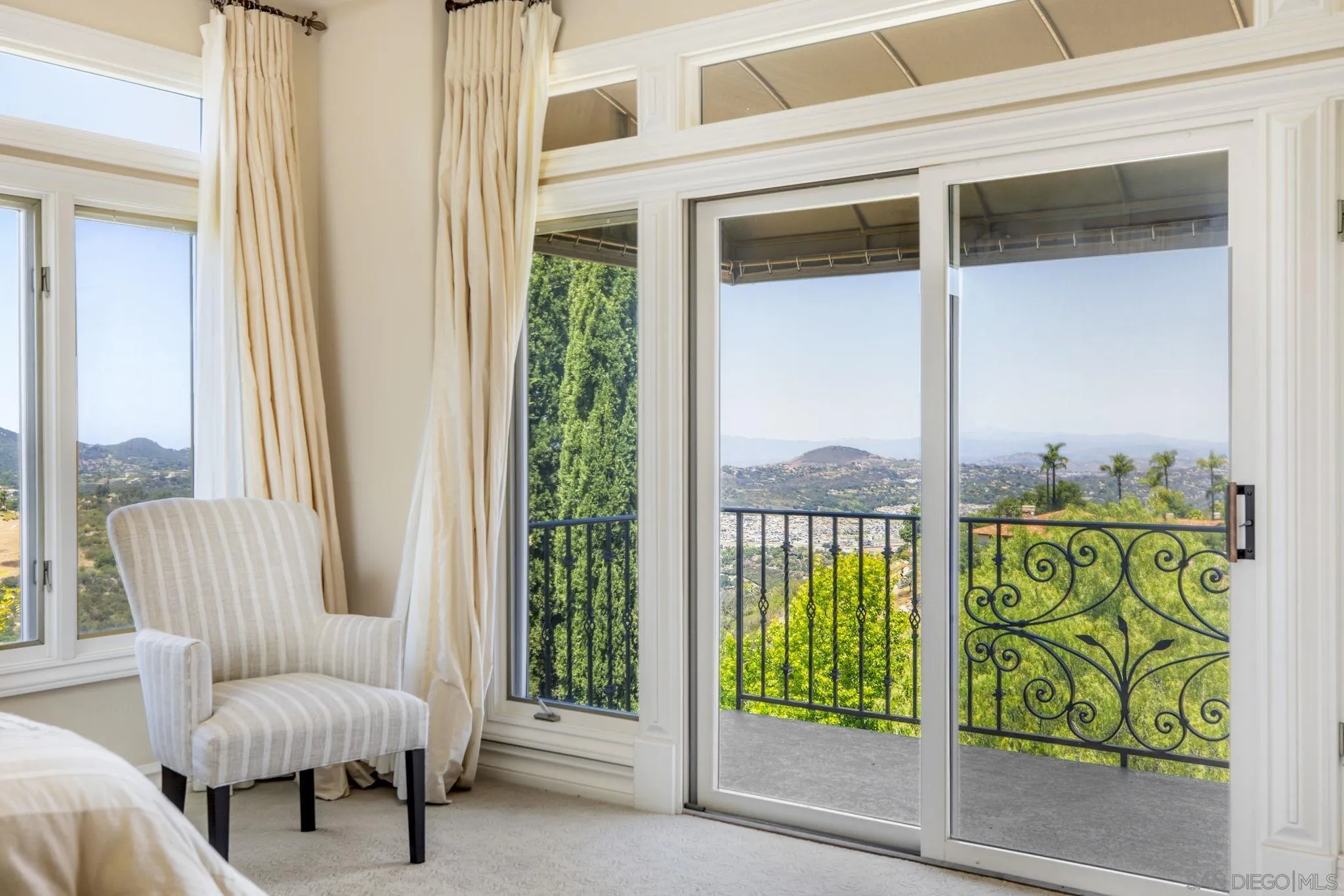 14440 Ridge Ranch Road Valley Center, CA 92082 - Photo 53 of 73 a living room with furniture and a floor to ceiling window