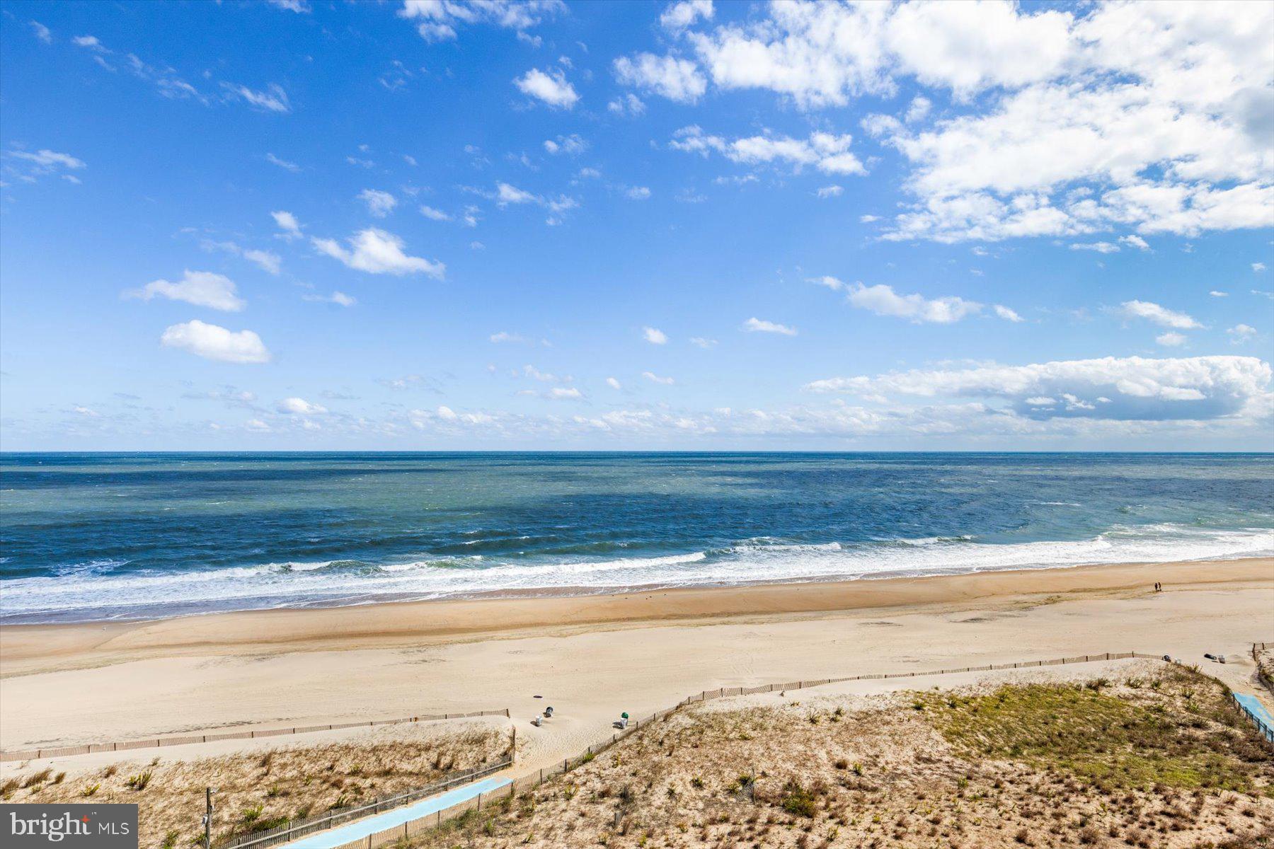 907 Georgetown House, Unit PH07 Bethany Beach, DE 19930 - Photo 1 of 48 a view of an ocean beach
