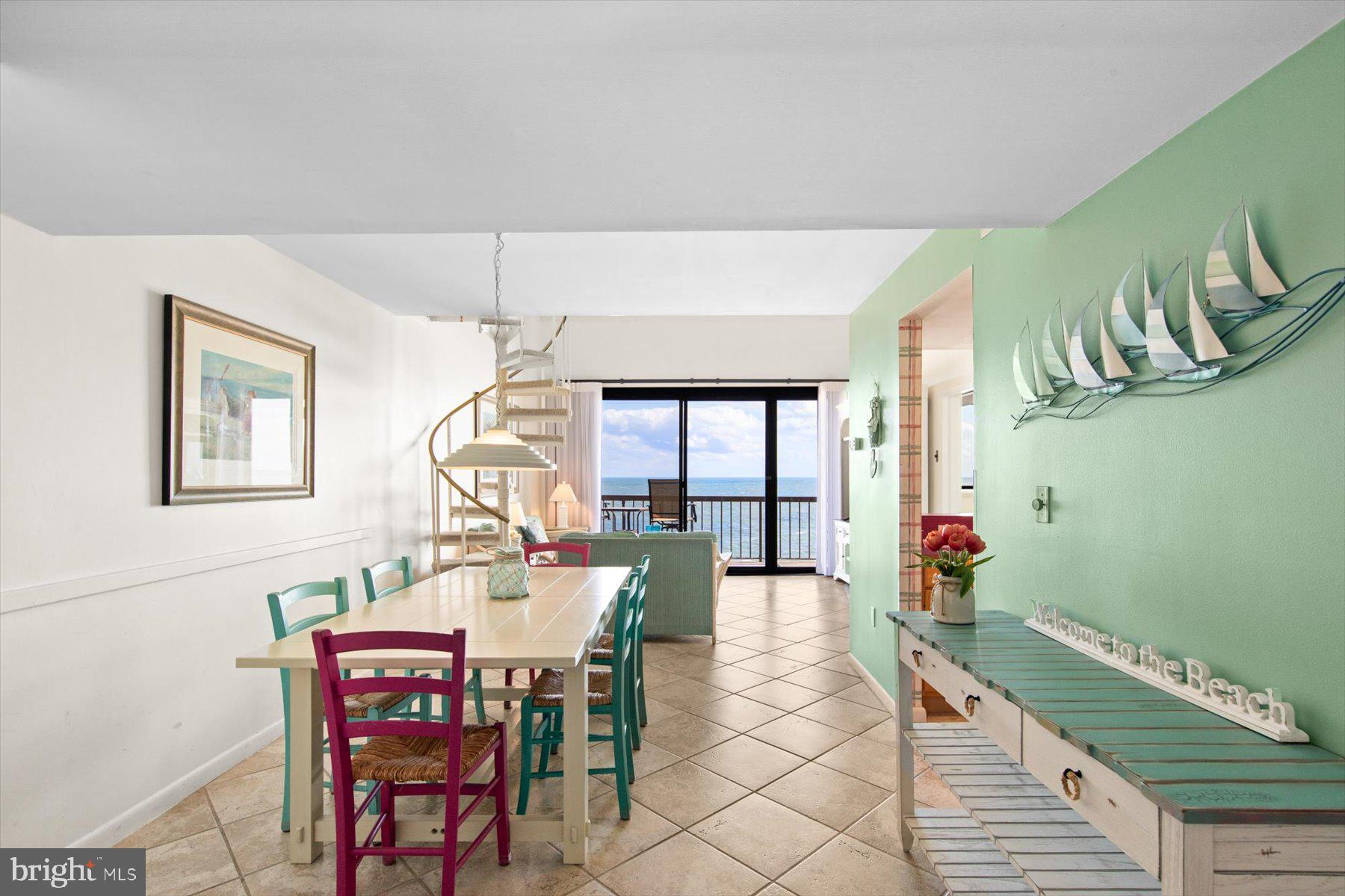 907 Georgetown House, Unit PH07 Bethany Beach, DE 19930 - Photo 13 of 48 a dining room with furniture and window