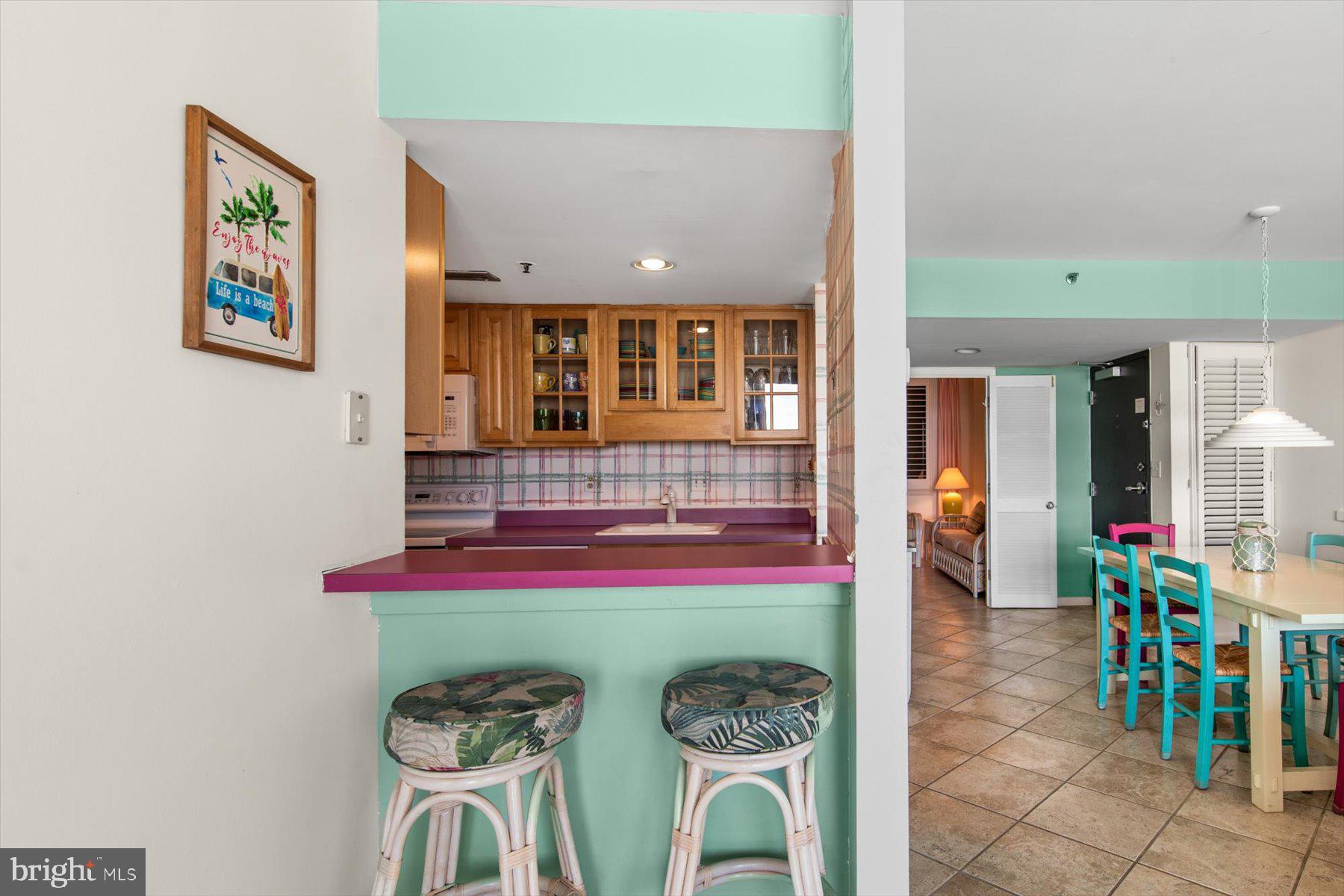 907 Georgetown House, Unit PH07 Bethany Beach, DE 19930 - Photo 16 of 48 a living room with furniture and a window