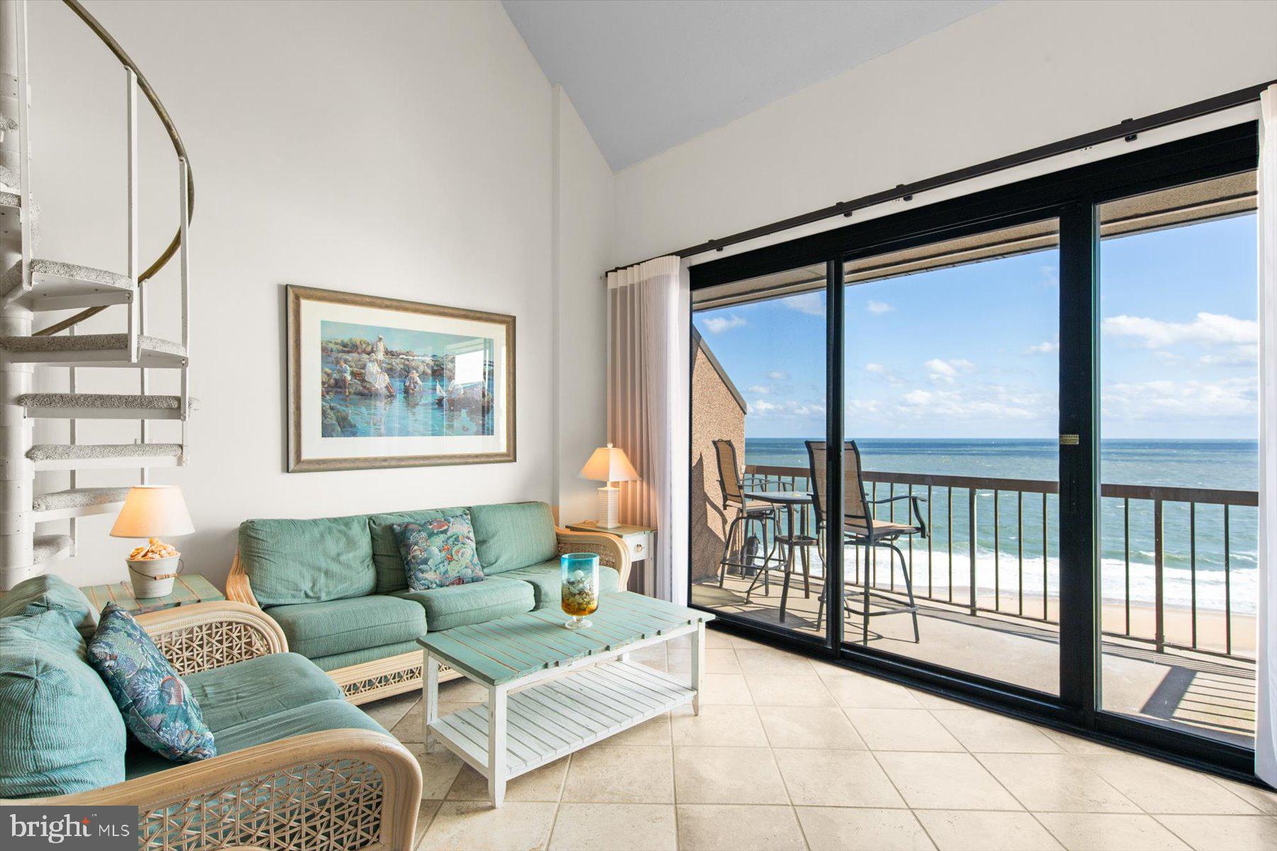 907 Georgetown House, Unit PH07 Bethany Beach, DE 19930 - Photo 3 of 48 a living room with furniture and a large window
