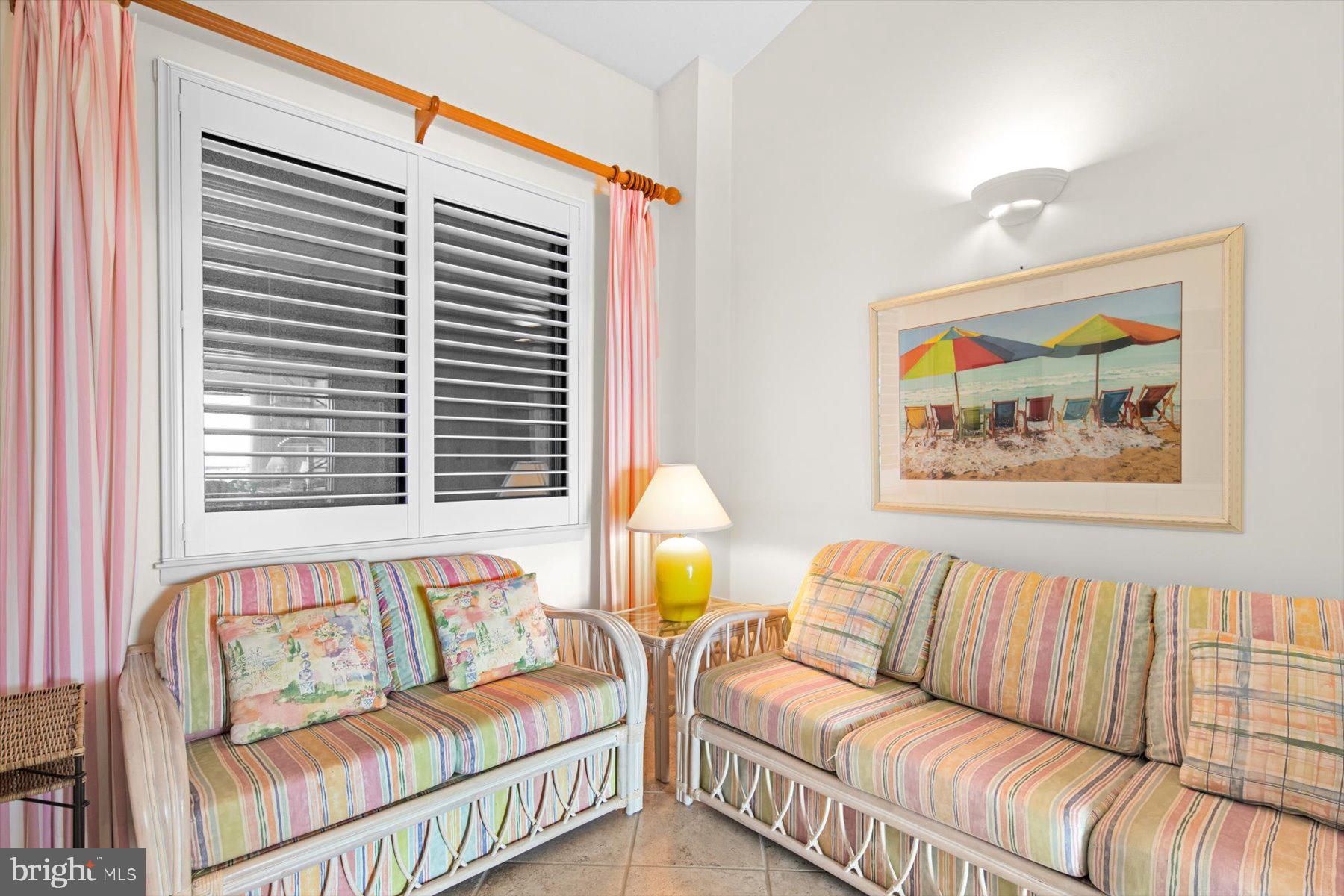 907 Georgetown House, Unit PH07 Bethany Beach, DE 19930 - Photo 32 of 48 a living room with furniture and a window