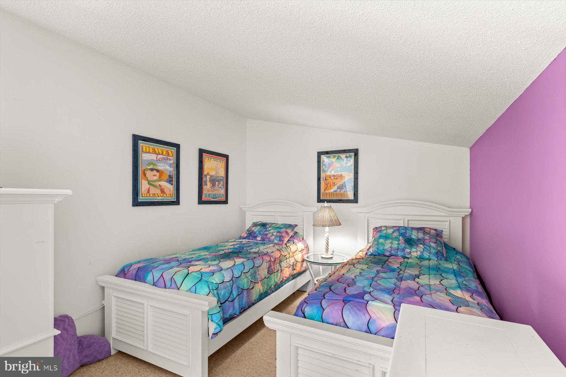 907 Georgetown House, Unit PH07 Bethany Beach, DE 19930 - Photo 35 of 48 a living room with furniture and a couch