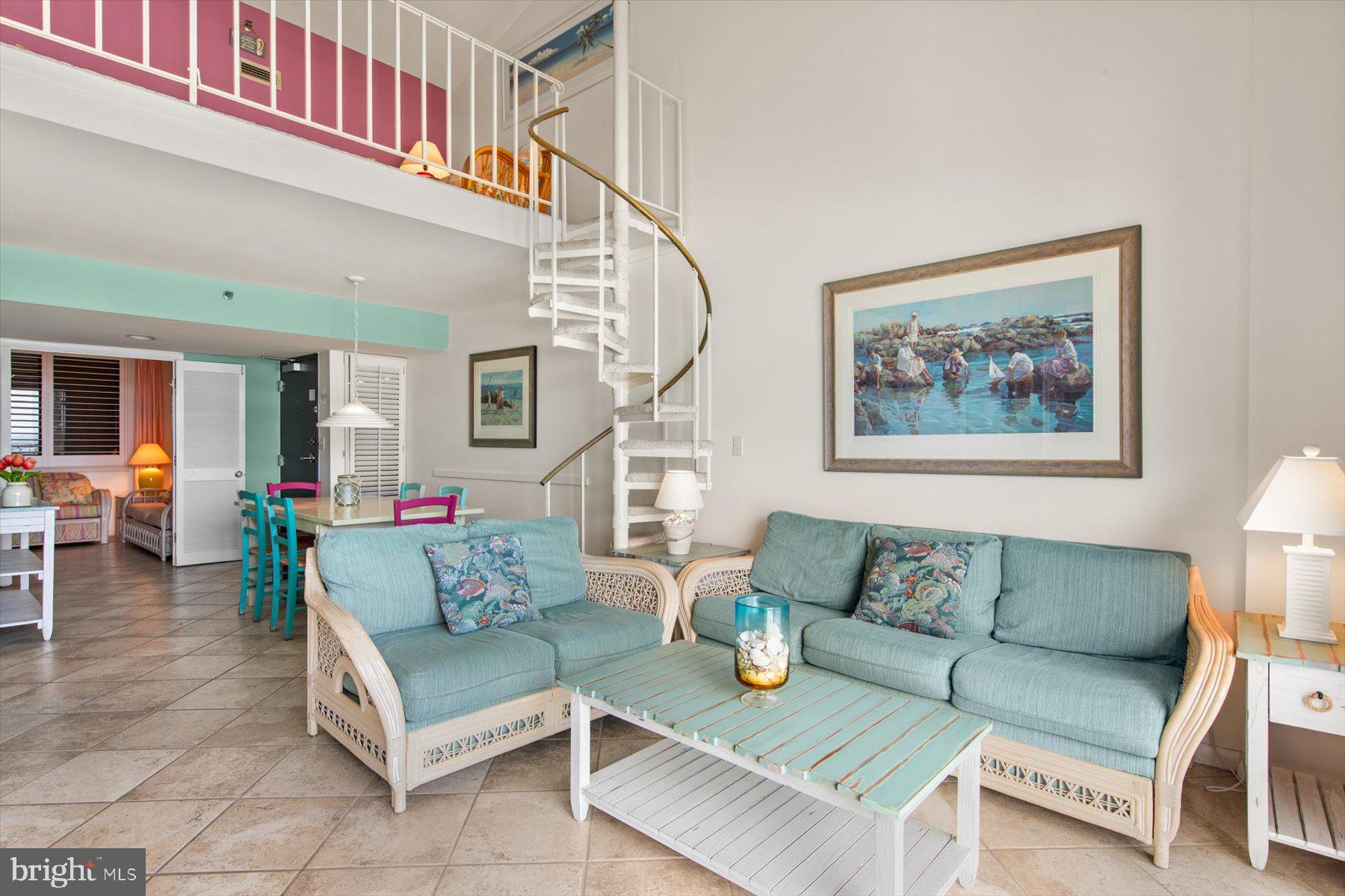 907 Georgetown House, Unit PH07 Bethany Beach, DE 19930 - Photo 5 of 48 a living room with furniture and a potted plant