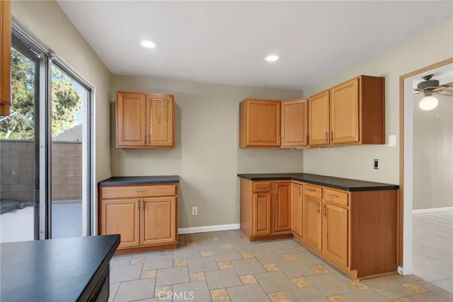 a kitchen with stainless steel appliances granite countertop a refrigerator sink and cabinets