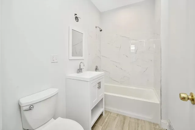 a bathroom with a sink toilet and bathtub
