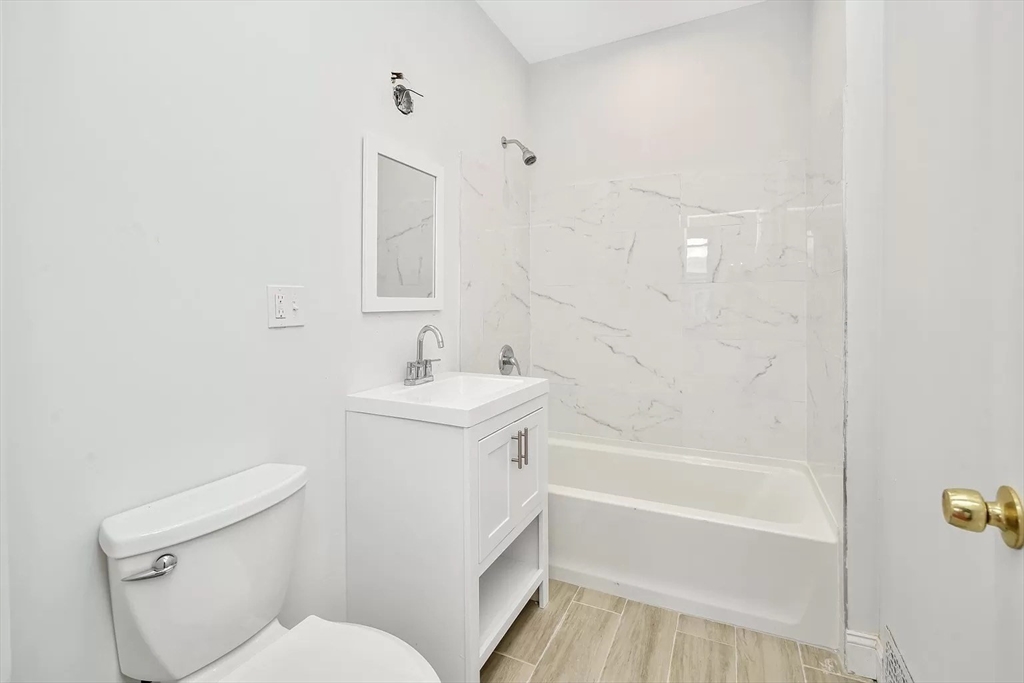 41 Dix Street, Unit 2 Boston, MA 02122 - Photo 12 of 19 a bathroom with a sink toilet and bathtub