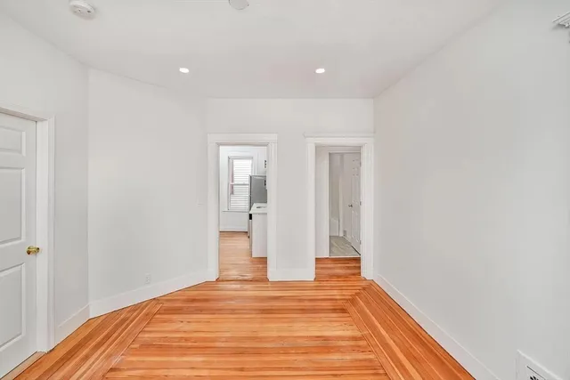 a view of a room with wooden floor and closet