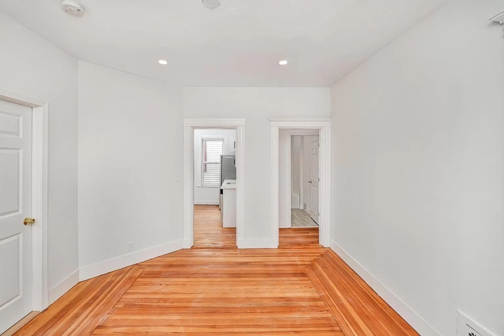 41 Dix Street, Unit 2 Boston, MA 02122 - Photo 19 of 19 a view of a room with wooden floor and closet