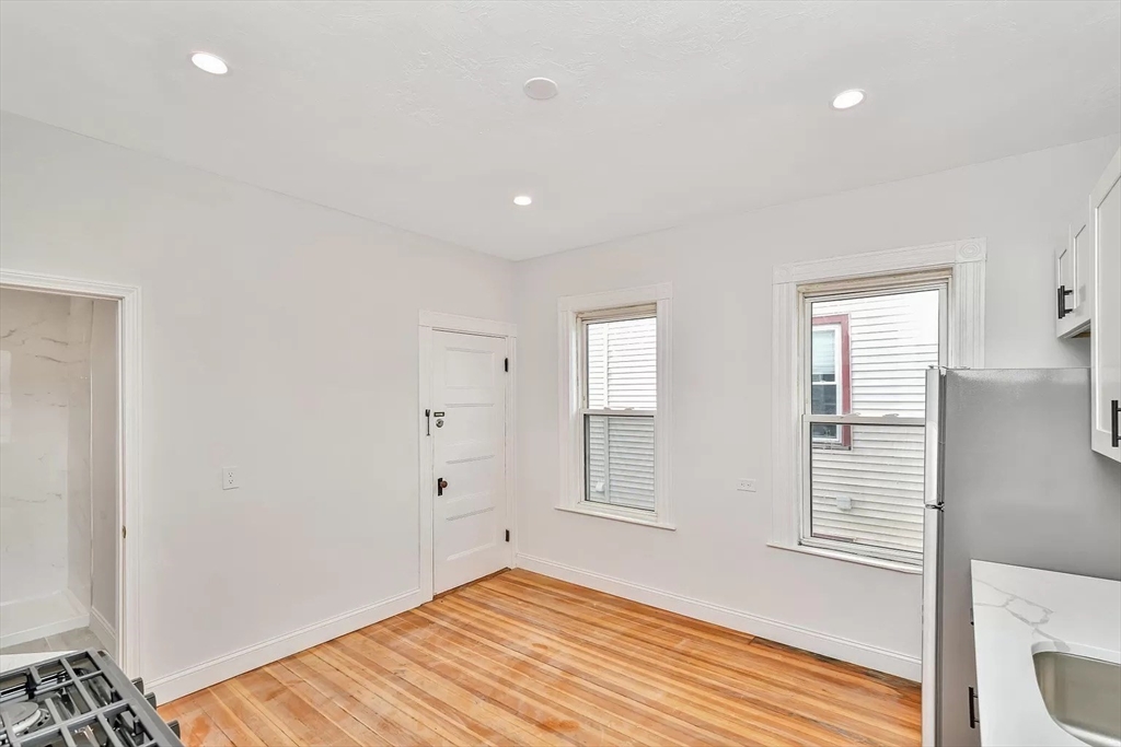 41 Dix Street, Unit 2 Boston, MA 02122 - Photo 4 of 19 a view of empty room with wooden floor and fan
