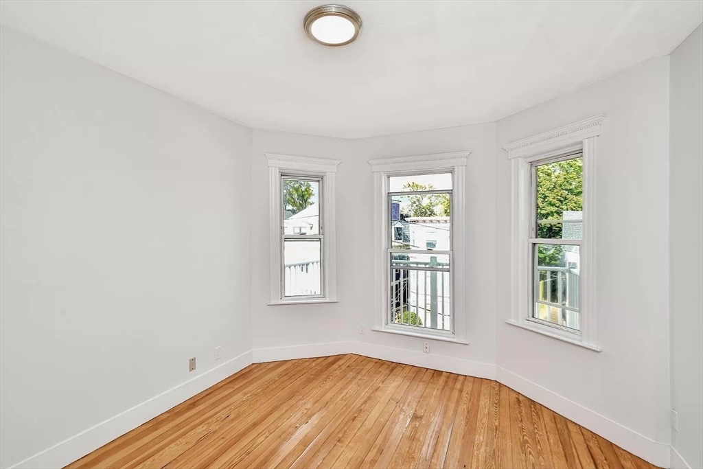 41 Dix Street, Unit 2 Boston, MA 02122 - Photo 8 of 19 an empty room with windows