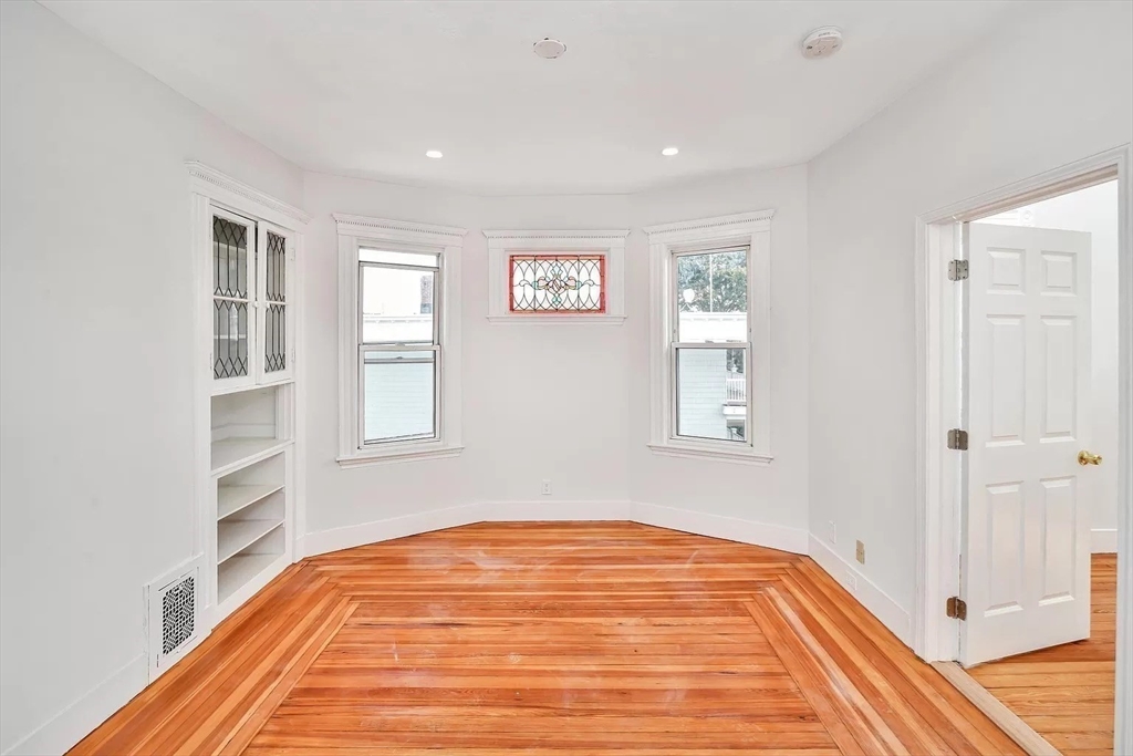 41 Dix Street, Unit 2 Boston, MA 02122 - Photo 9 of 19 a view of a room with wooden floor and windows
