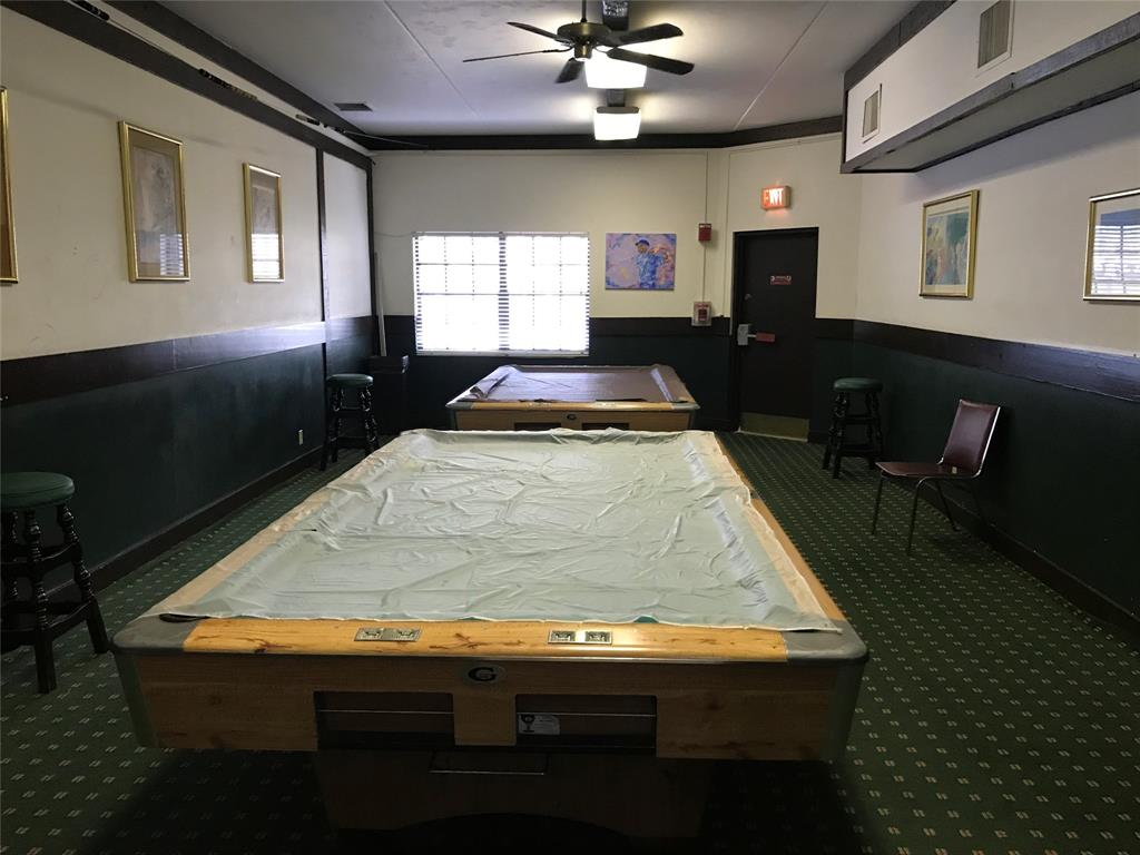 3680 Inverrary Drive, Unit 3R Lauderhill, FL 33319 - Photo 21 of 21 a room with kitchen island granite countertop furniture and a fireplace