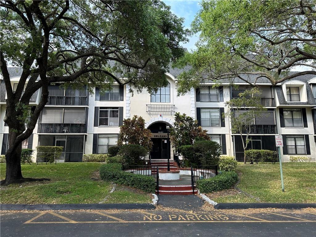 3680 Inverrary Drive, Unit 3R Lauderhill, FL 33319 - Photo 7 of 21 a front view of a house with a yard