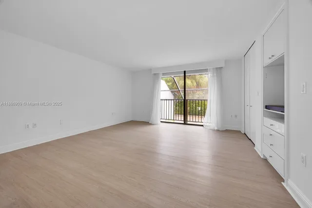 a view of an empty room and entryway