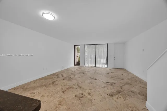 a view of an empty room and window