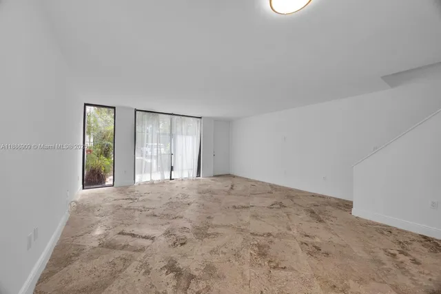 a view of an empty room with window