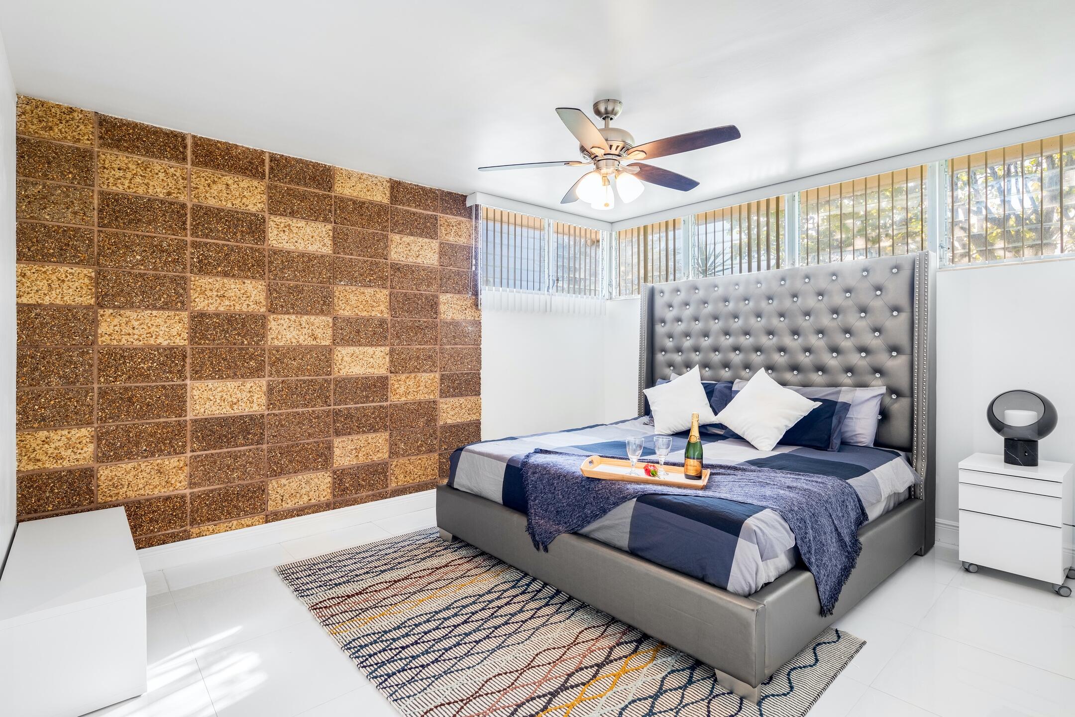 7306 Clarke Road Lake Clarke Shores, FL 33406 - Photo 12 of 36 a bed room with a bed and a couch