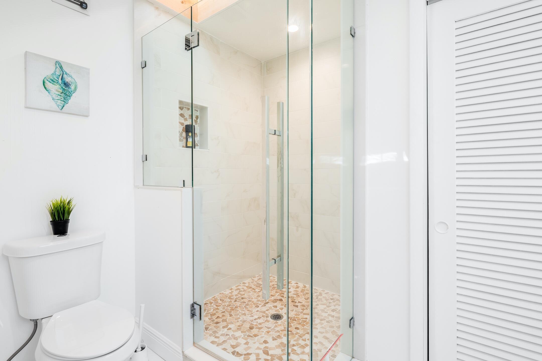 7306 Clarke Road Lake Clarke Shores, FL 33406 - Photo 14 of 36 a bathroom with a toilet and shower