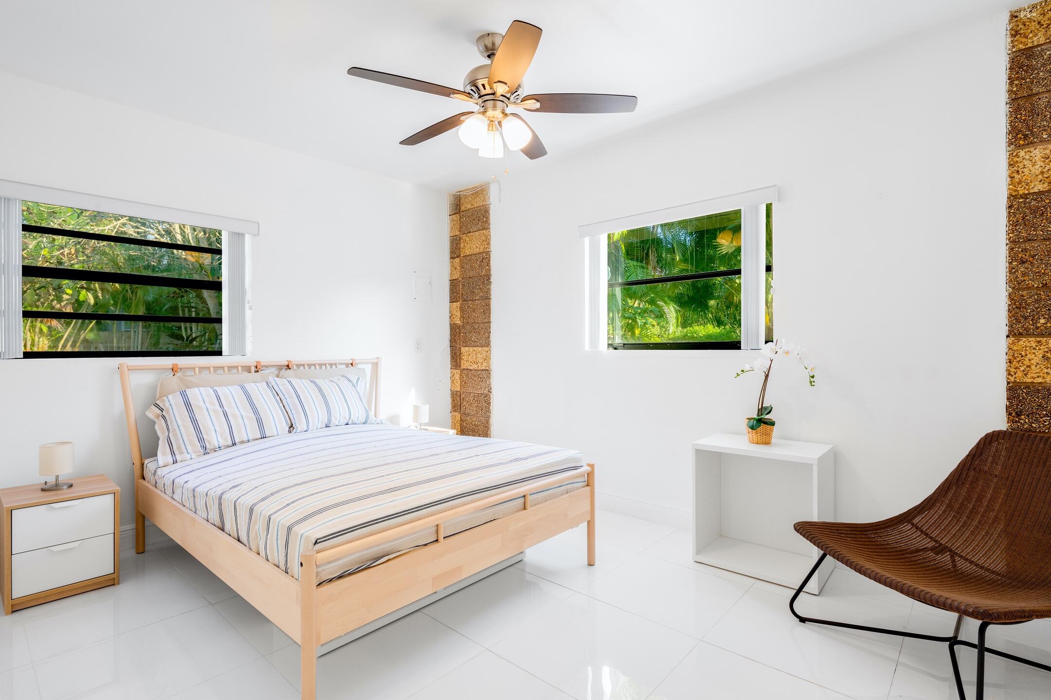 7306 Clarke Road Lake Clarke Shores, FL 33406 - Photo 22 of 36 a bedroom with a bed and a couch