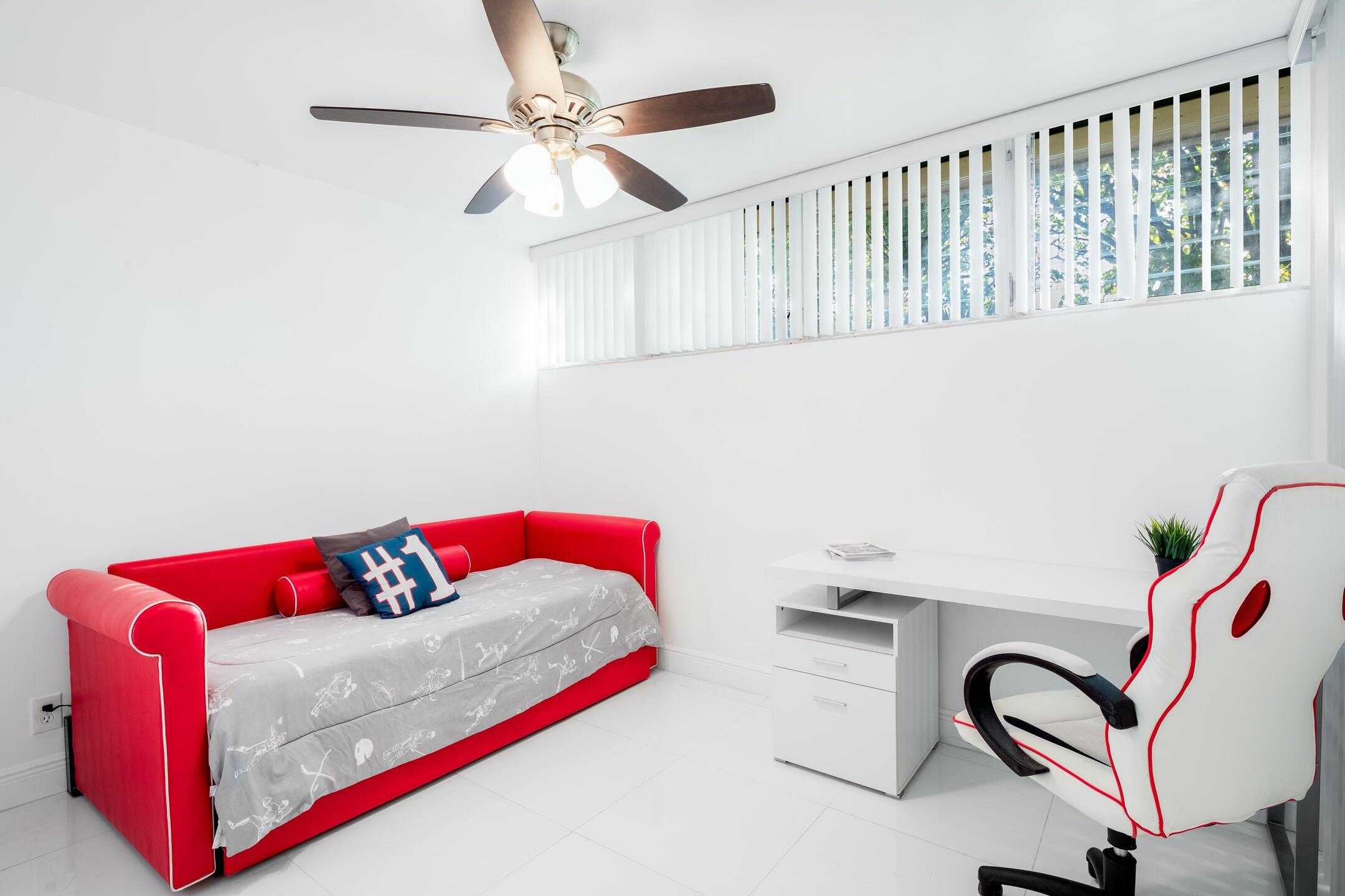 7306 Clarke Road Lake Clarke Shores, FL 33406 - Photo 23 of 36 a bedroom with a bed and a dresser