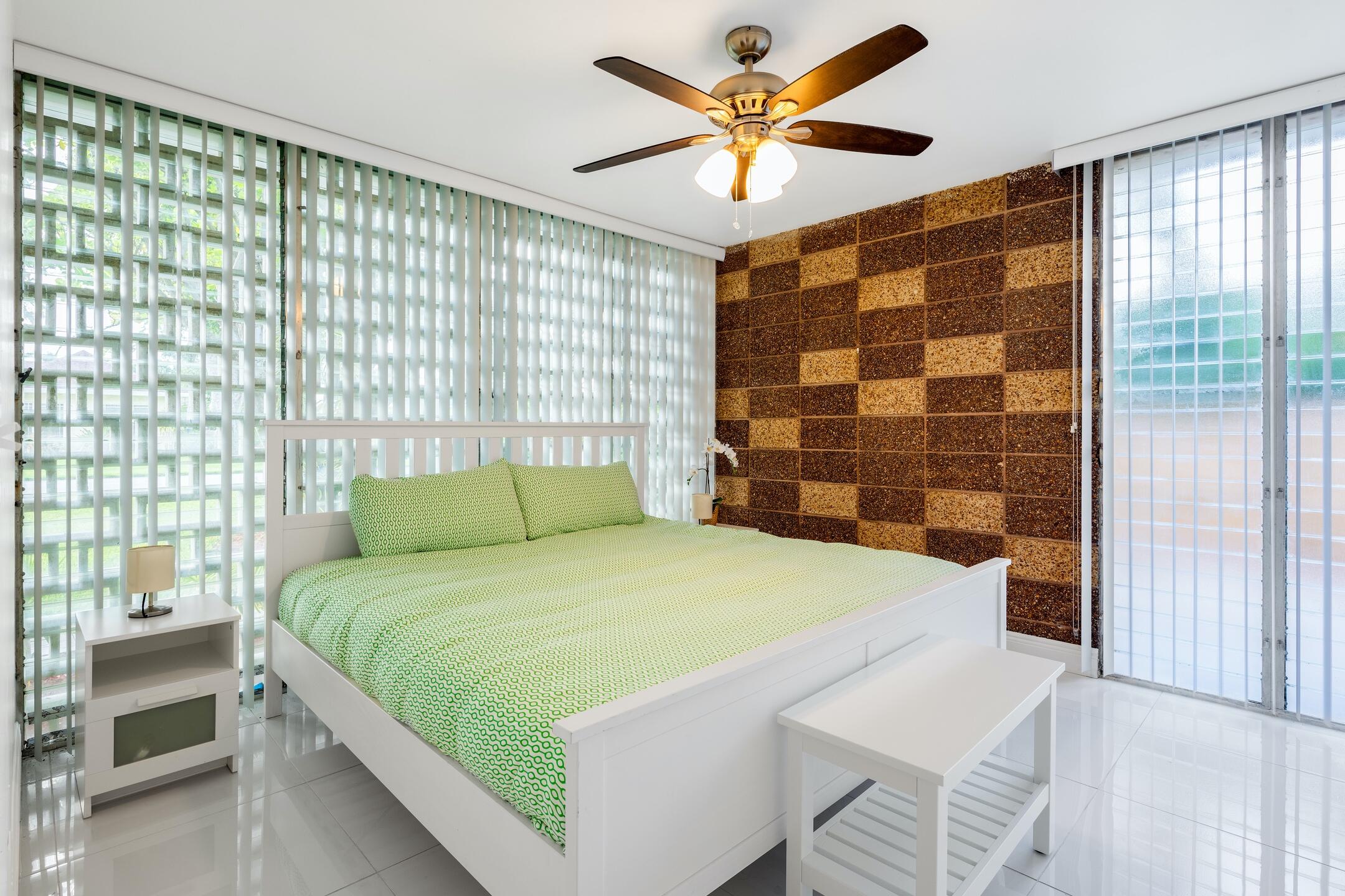 7306 Clarke Road Lake Clarke Shores, FL 33406 - Photo 24 of 36 a bedroom with a bed and a window