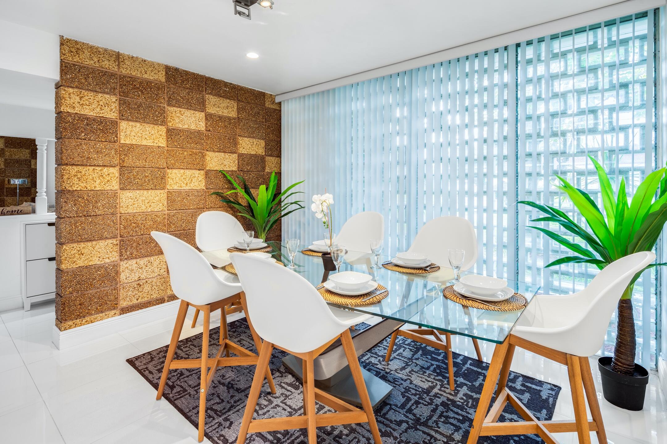 7306 Clarke Road Lake Clarke Shores, FL 33406 - Photo 30 of 36 a view of a dining room with furniture and wooden floor