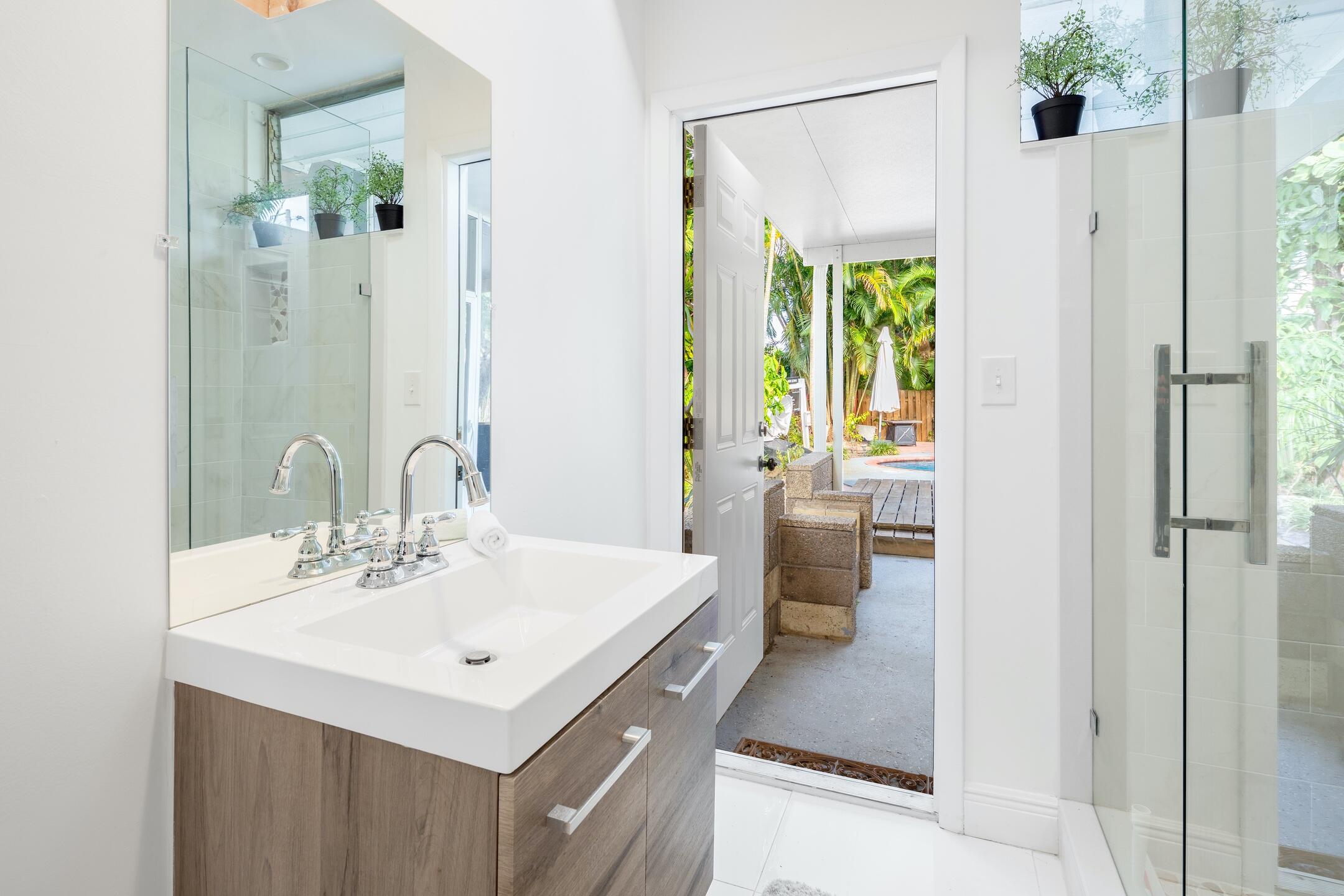 7306 Clarke Road Lake Clarke Shores, FL 33406 - Photo 32 of 36 a bathroom with a sink a toilet and shower
