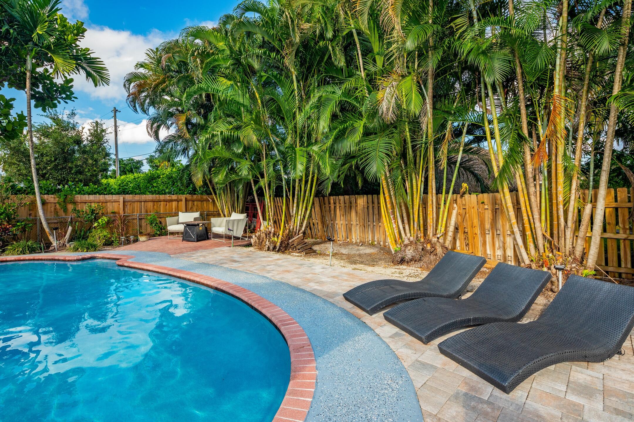 7306 Clarke Road Lake Clarke Shores, FL 33406 - Photo 5 of 36 a view of a backyard with swimming pool