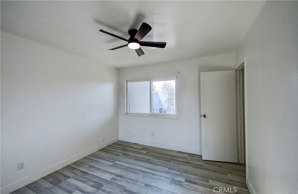 474 West Jackson Street Rialto, CA 92376 - Photo 12 of 14 a view of empty room with wooden floor and fan