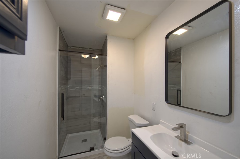 474 West Jackson Street Rialto, CA 92376 - Photo 5 of 14 a bathroom with a sink a toilet and shower