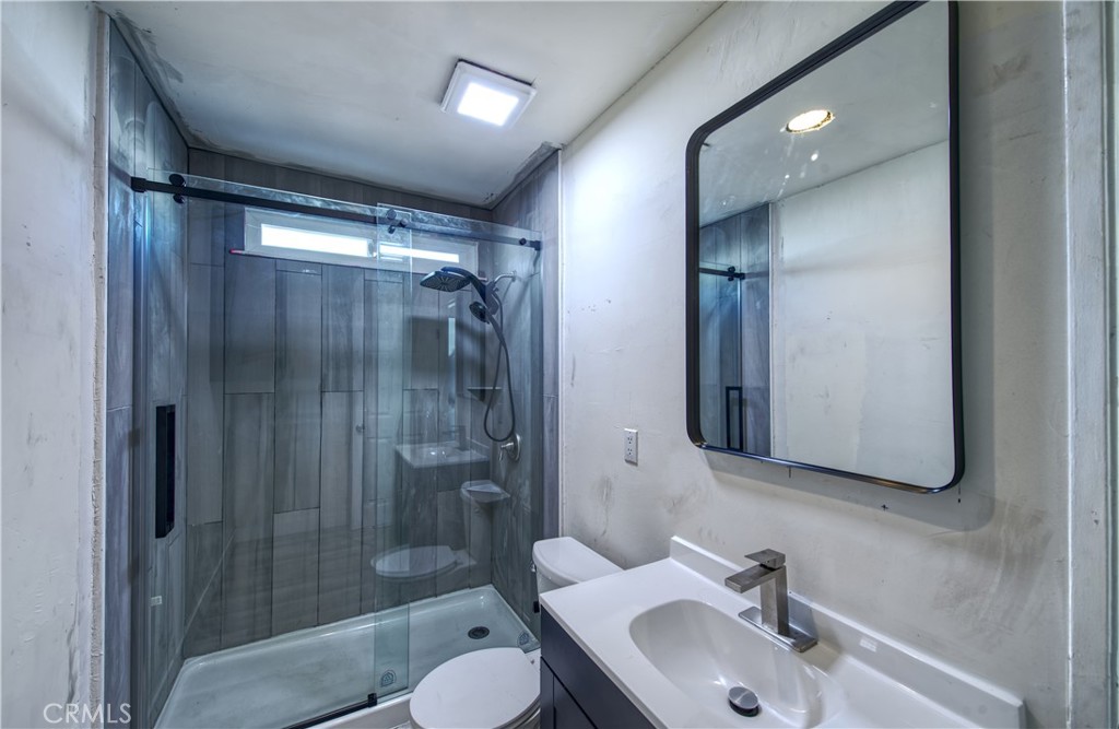 474 West Jackson Street Rialto, CA 92376 - Photo 8 of 14 a bathroom with a sink toilet and shower