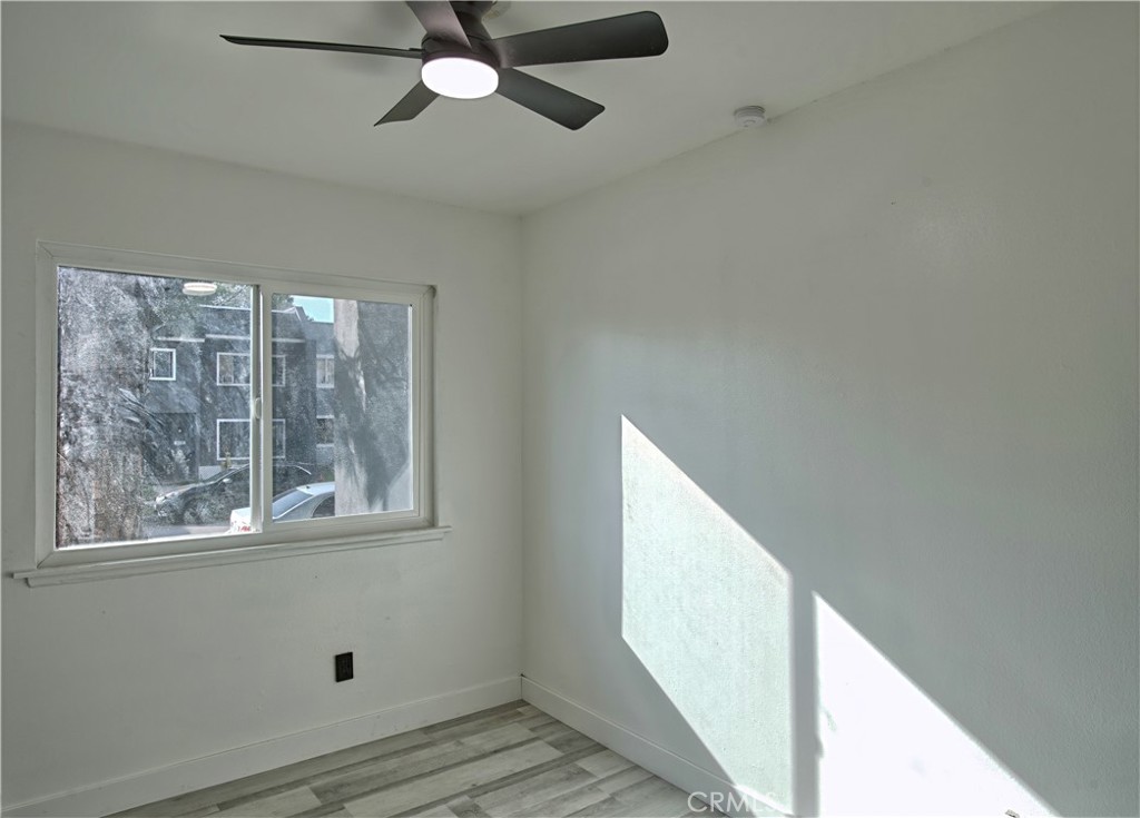 474 West Jackson Street Rialto, CA 92376 - Photo 9 of 14 a view of empty room with wooden floor and fan