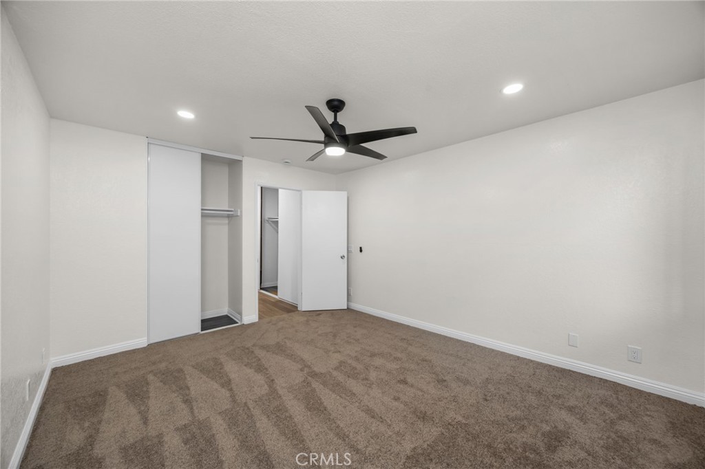 600 West 3rd Street, Unit B205 Santa Ana, CA 92701 - Photo 16 of 34 a view of a livingroom with a ceiling fan and wooden floor