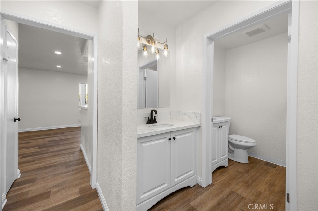 600 West 3rd Street, Unit B205 Santa Ana, CA 92701 - Photo 18 of 34 a bathroom with a sink a toilet and shower