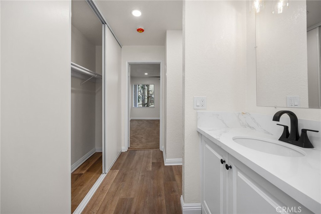600 West 3rd Street, Unit B205 Santa Ana, CA 92701 - Photo 21 of 34 a bathroom with a sink and mirror
