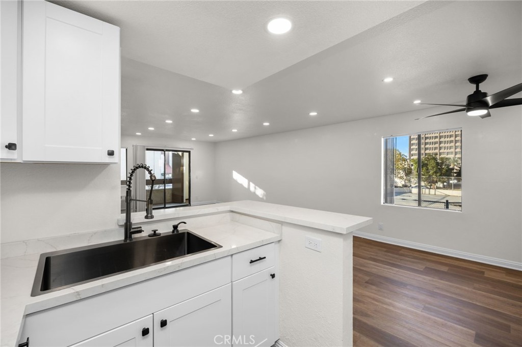600 West 3rd Street, Unit B205 Santa Ana, CA 92701 - Photo 10 of 34 a kitchen with a sink and cabinets