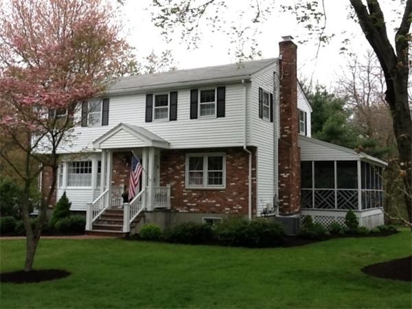 5 Ward Road Sudbury, MA 01776 - Photo 1 of 25 a front view of a house with a garden and trees