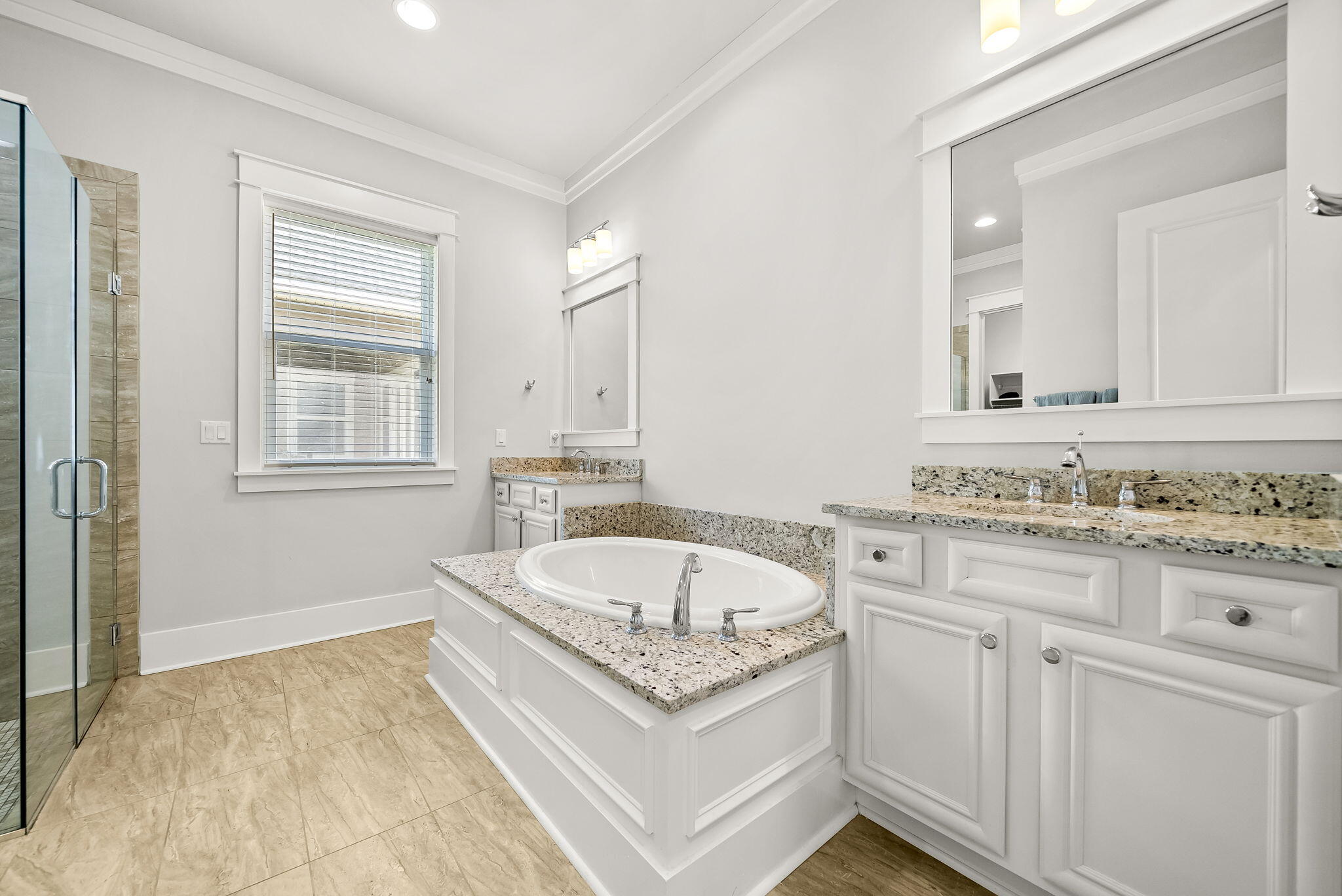 209 Blakely Drew Boulevard Santa Rosa Beach, FL 32459 - Photo 21 of 45 a spacious bathroom with a granite countertop tub sink and mirror