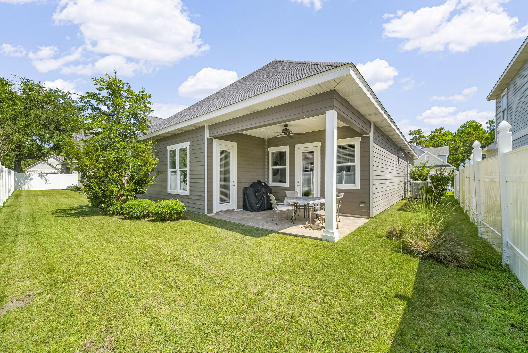 209 Blakely Drew Boulevard Santa Rosa Beach, FL 32459 - Photo 33 of 45 a view of a house with backyard porch and sitting area