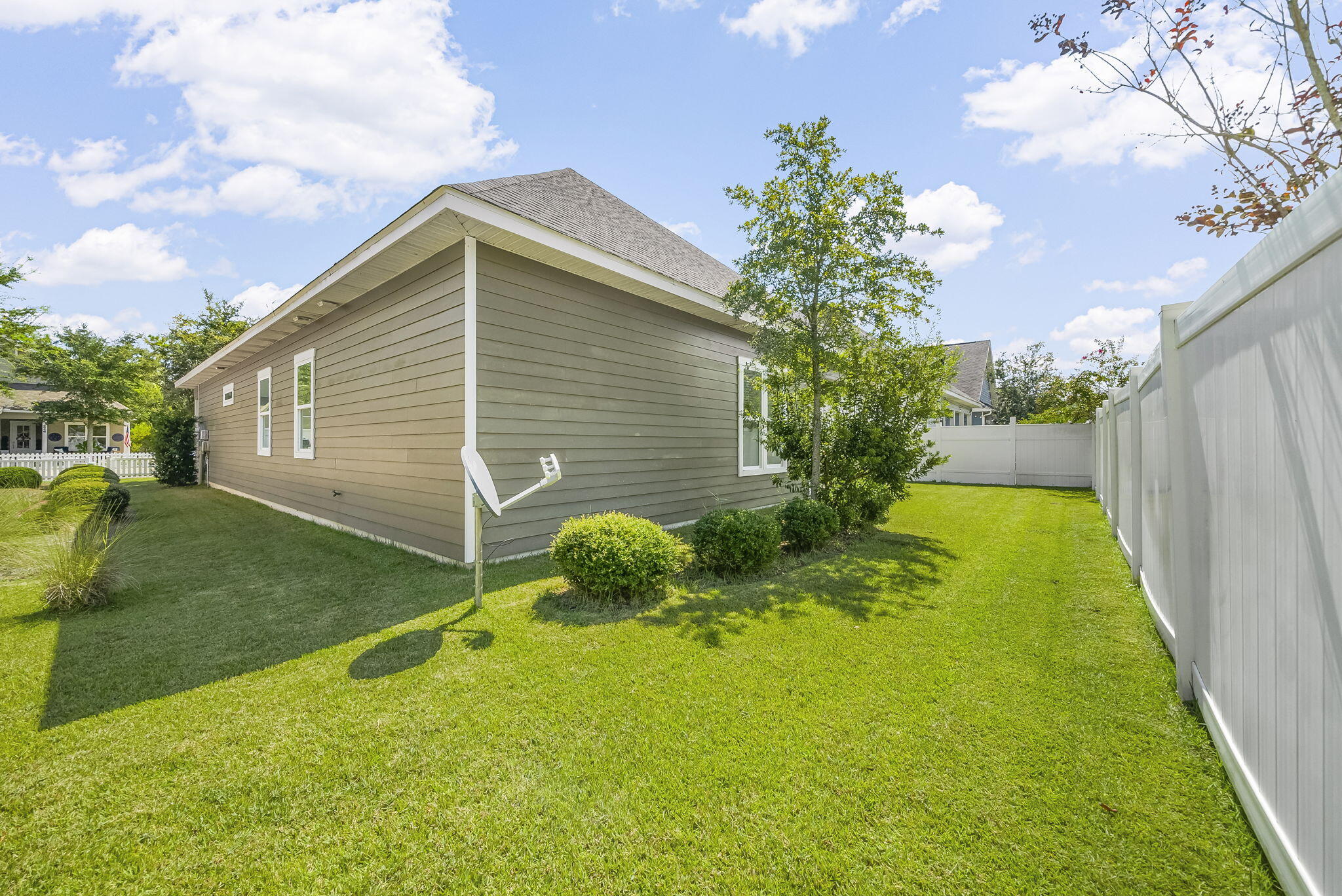 209 Blakely Drew Boulevard Santa Rosa Beach, FL 32459 - Photo 35 of 45 a backyard of a house with plants and entertaining space