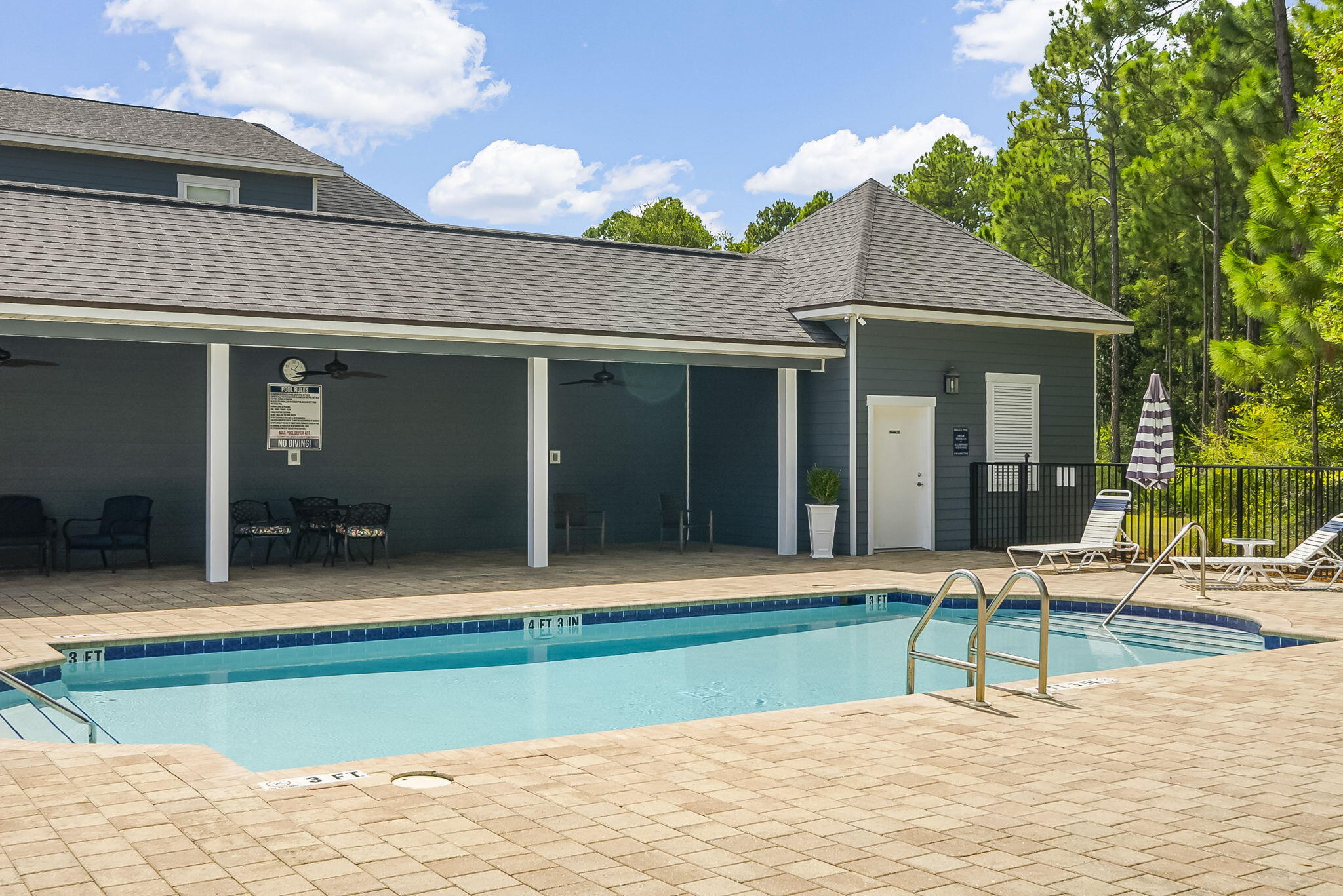 209 Blakely Drew Boulevard Santa Rosa Beach, FL 32459 - Photo 40 of 45 a house with a bench in front of it