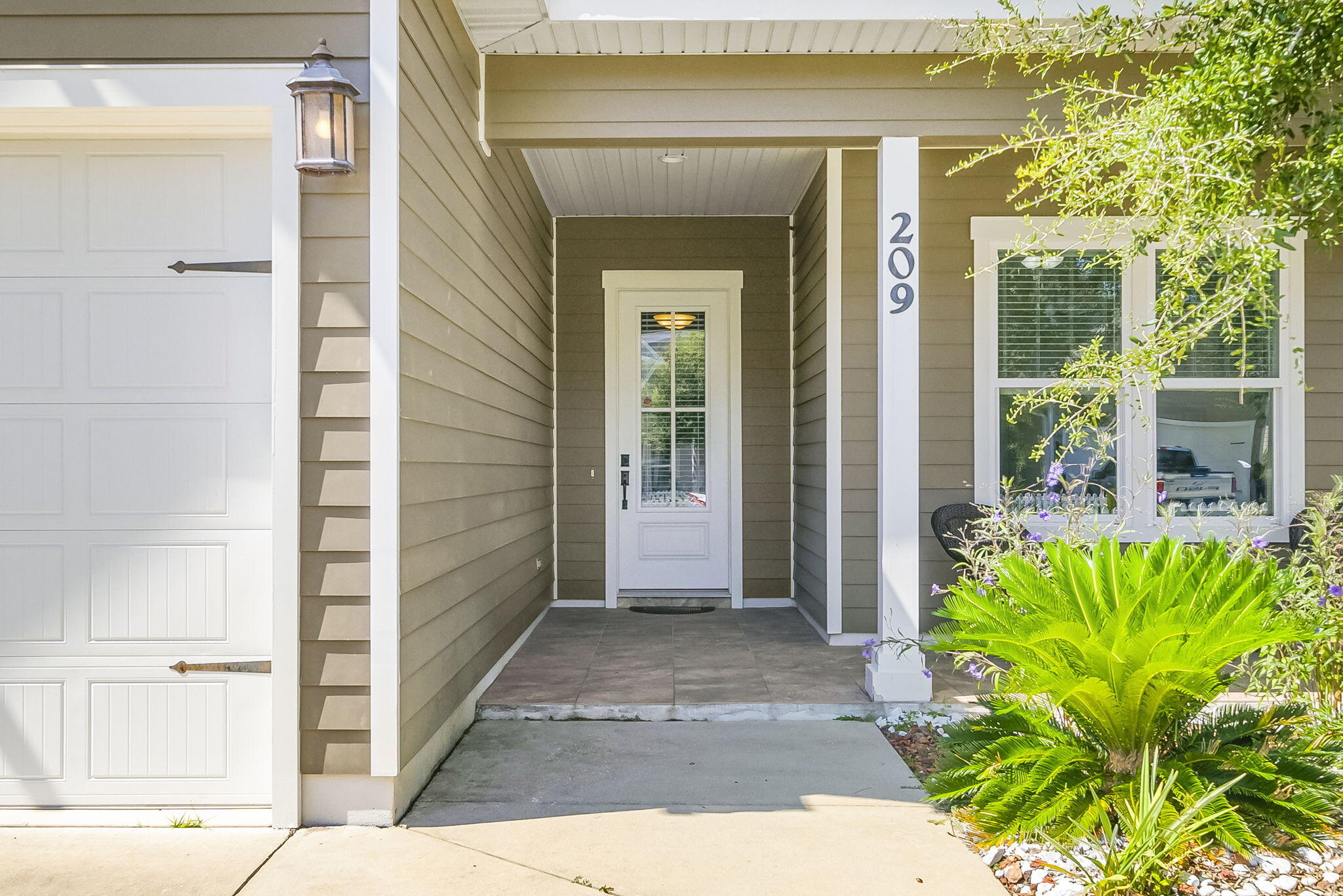 209 Blakely Drew Boulevard Santa Rosa Beach, FL 32459 - Photo 6 of 45 a view of a entryway door front of house